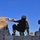 Pvt. Kris White scales a wall while on a patrol