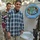 Sadr City man turns on a faucet in his home