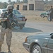 Sgt. Kim Brasfield elevates his weapon to a ready position
