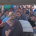 A long line of Iraqis wait for their turn to fill up on kerosene