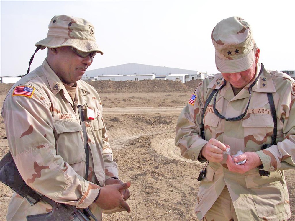 Soldiers shares a laugh with Maj. Gen. Bennett C. Landreneau