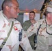 Master Sgt. Bruce Jackson is persuaded to try some snacks