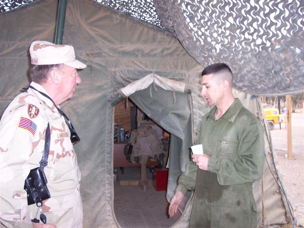 MGen. Bennett C. Landreneau speaks with SFC Jody Hunt