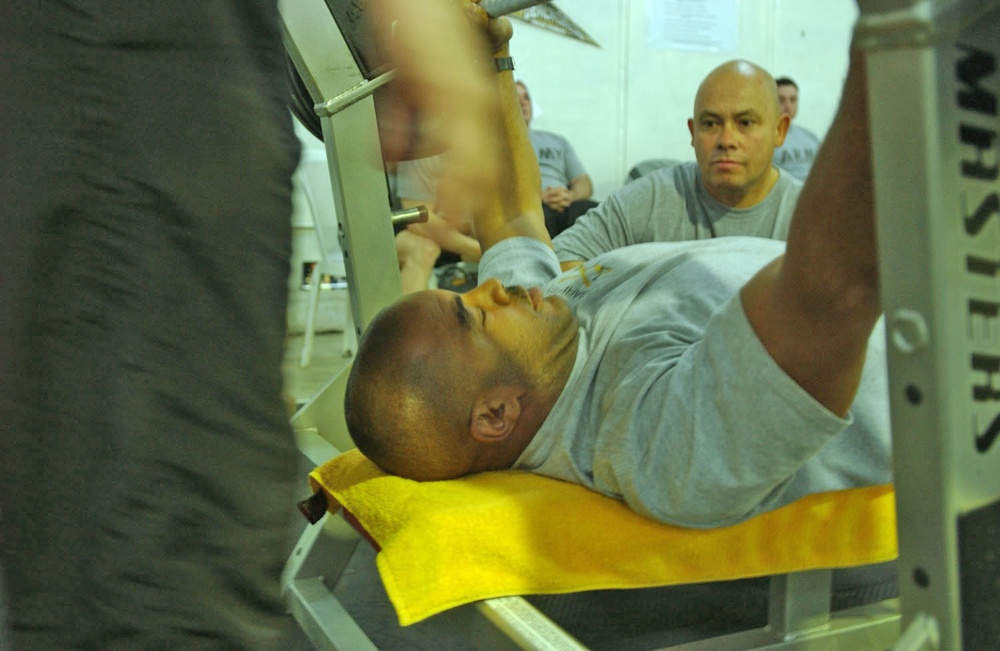 CW03 Michael Zanders prepares to bench press 405 lbs