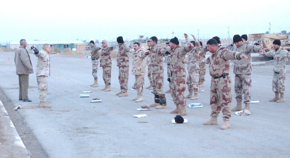 Sgt. Mateo leads Iraqi Regular Army Battalion in stretches