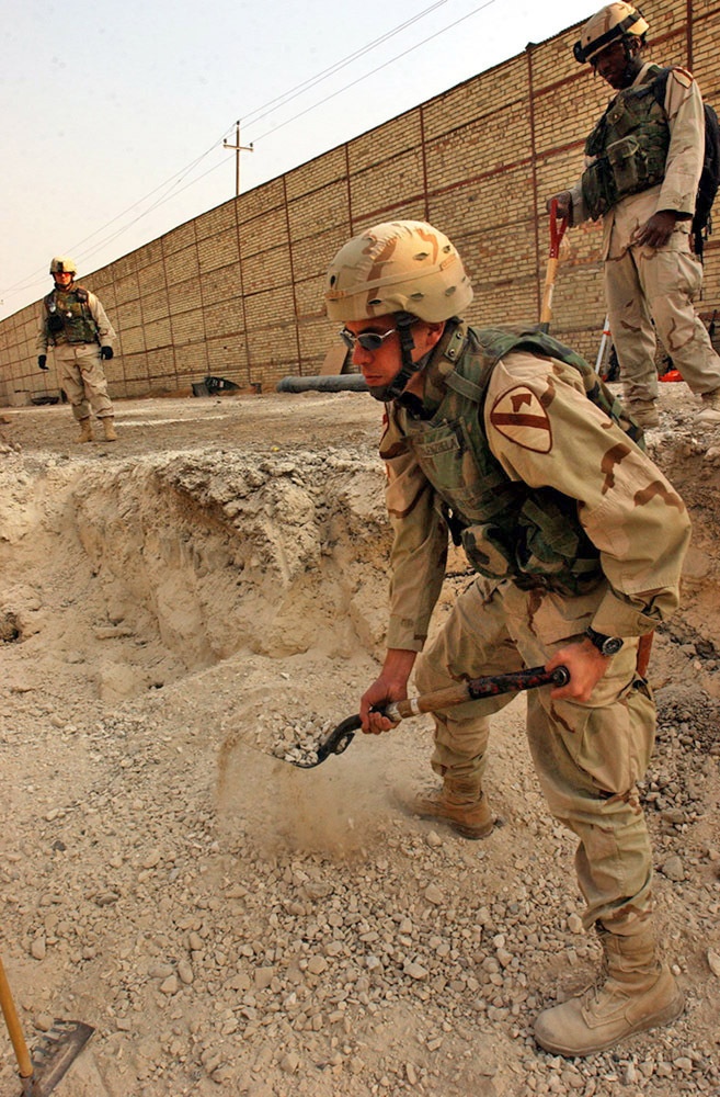 Doing the grunt work is Spc. David Valenzuela