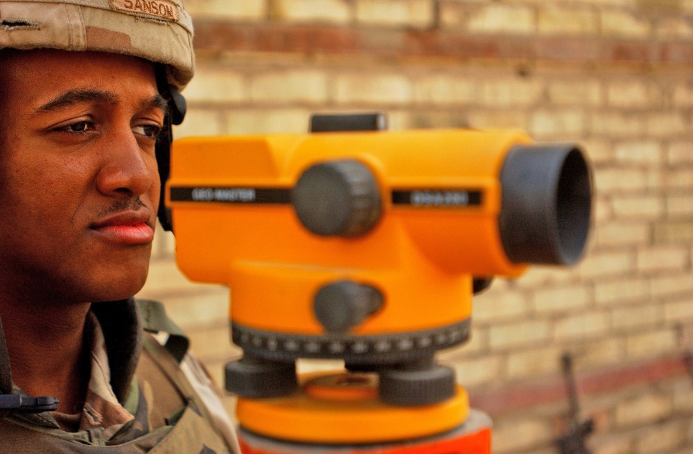 Spc. Dante Sansom mans a surveying device