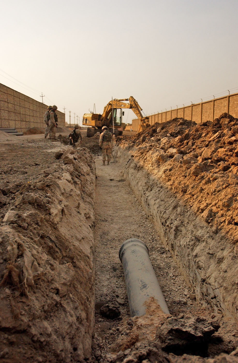 The combat engineers survey the land, dig the ditches