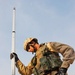 Spc. Johnson holds still while elevation measurements are taken