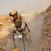 Spc. Antwon Holmes uses a soil tamper