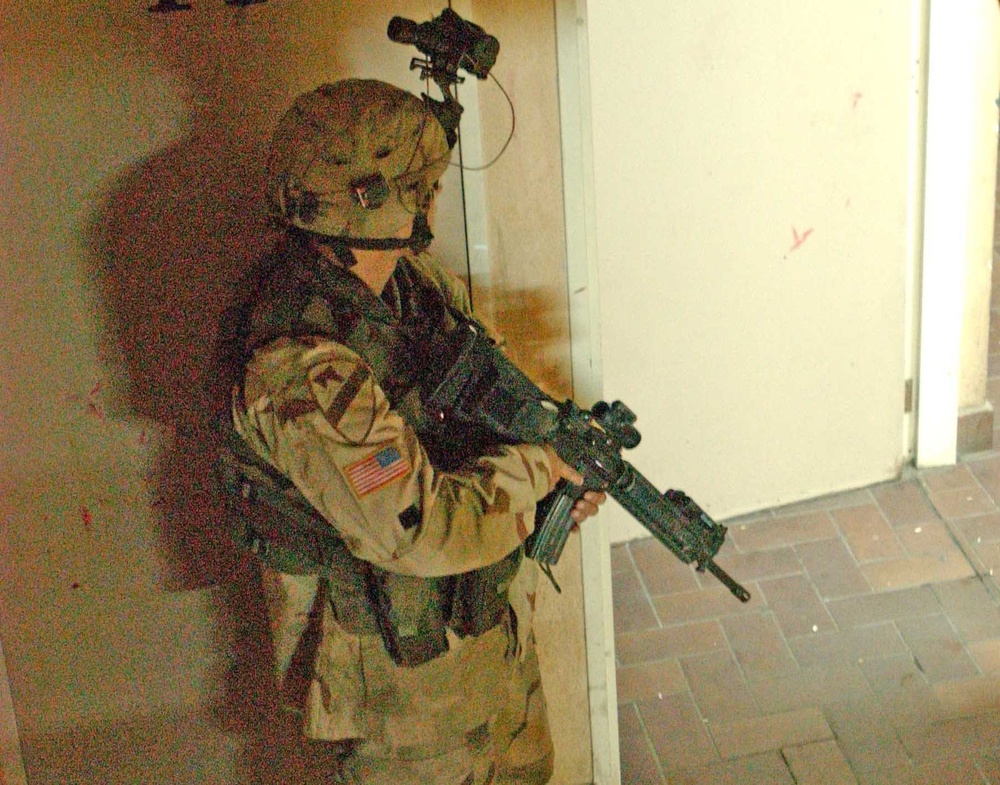 A Soldier stands guard at an open doorway