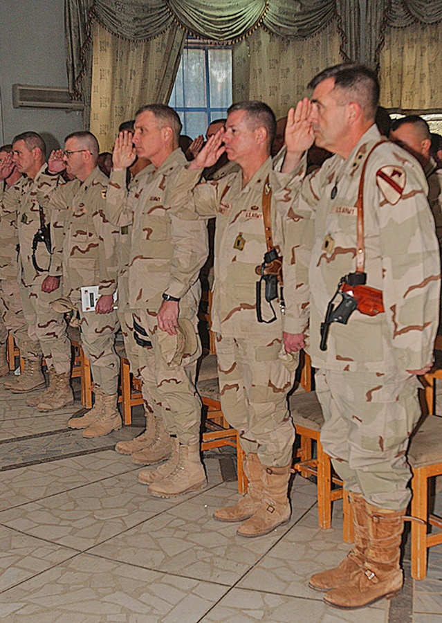 Soldiers offer a salute during a memorial ceremony