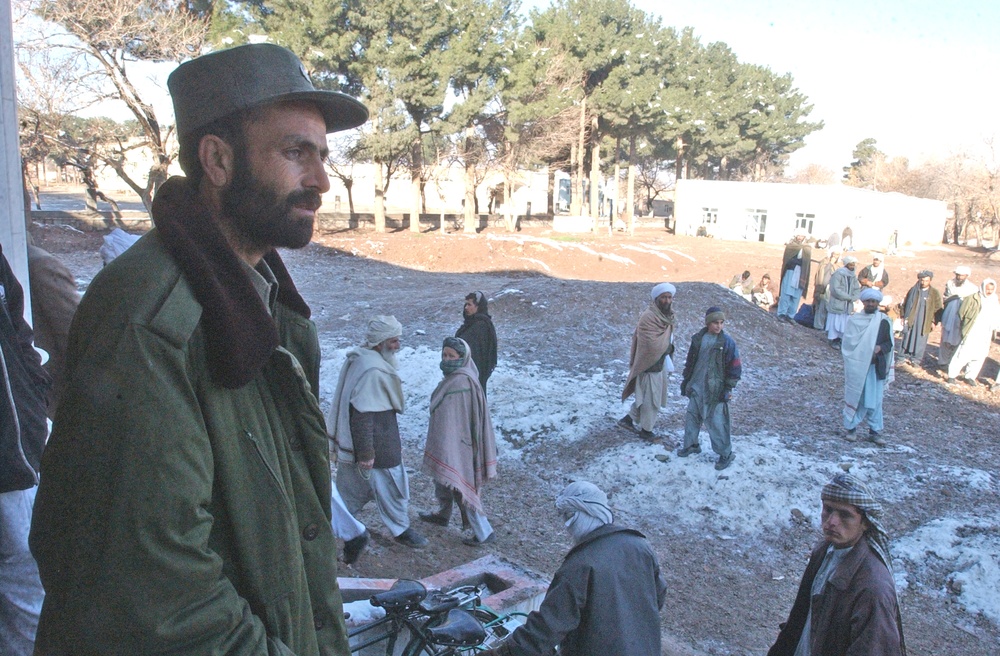 An ANP officer stands guard outside