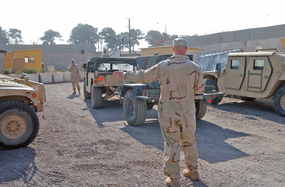 Sgt. John Fox ground guide Pfc. Jeremy Stanley