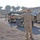 Sgt. John Fox ground guide Pfc. Jeremy Stanley