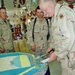 Sgt. Maj. John Morrow serves a piece of cake
