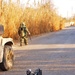 Explosive ordnance disposal officer inspect the aftermath