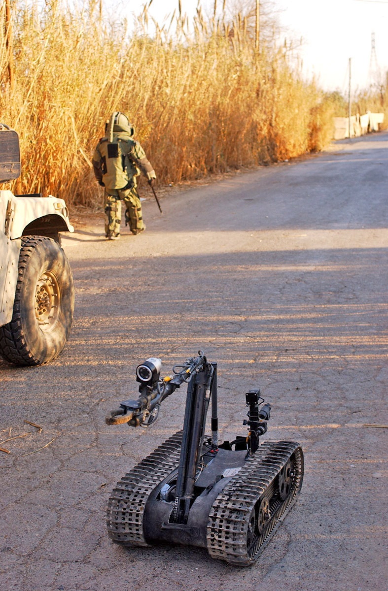 Explosive ordnance disposal officer inspect the aftermath