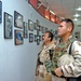Soldiers look at graphic photos of victims