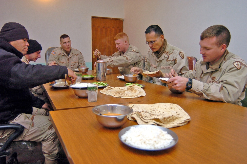 Soldiers enjoy a traditional Kurdish dinner