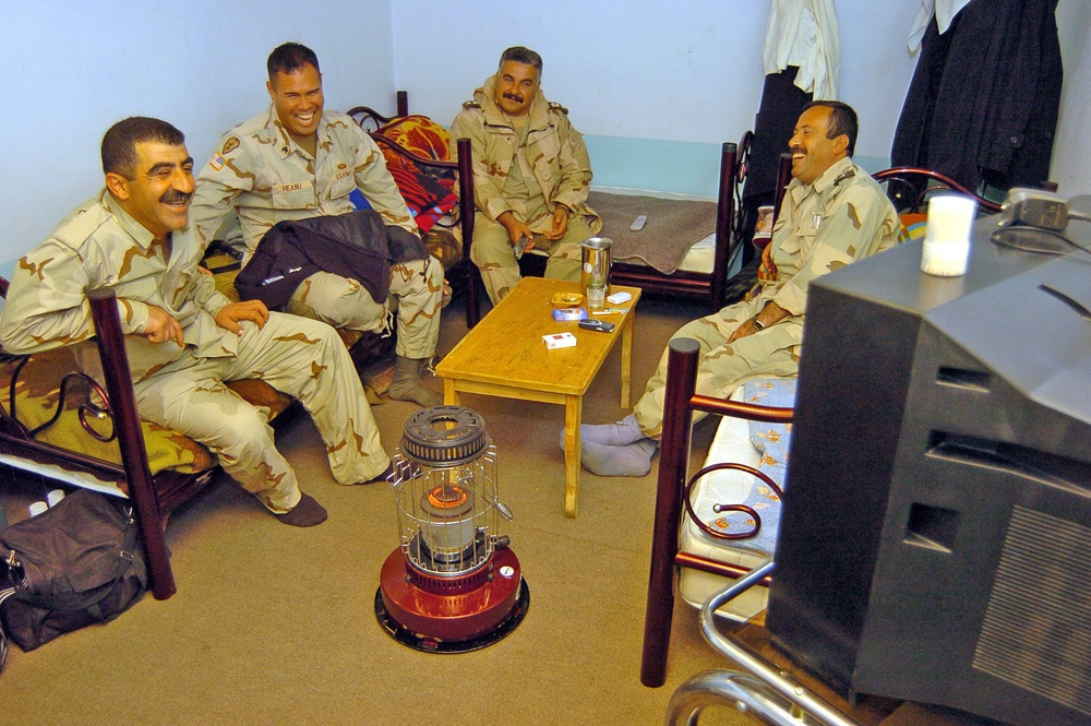 Soldiers shares a laugh with some Halabja DBE officers