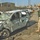 A Soldier looks over a vehicle that was destroyed