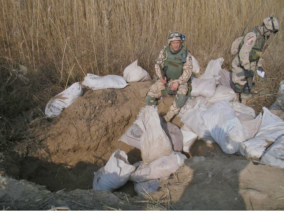 Soldiers look through bags of explosive material