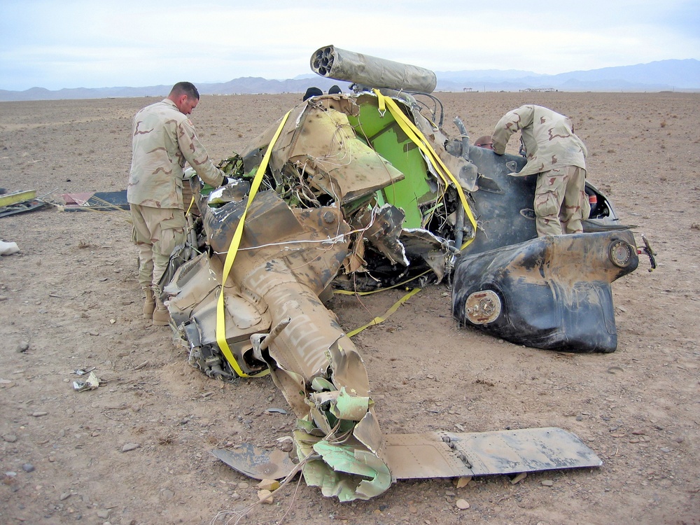 Soldiers work to remove the wreckage