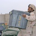 SSgt. Darrell Gray moves a  box of office supplies