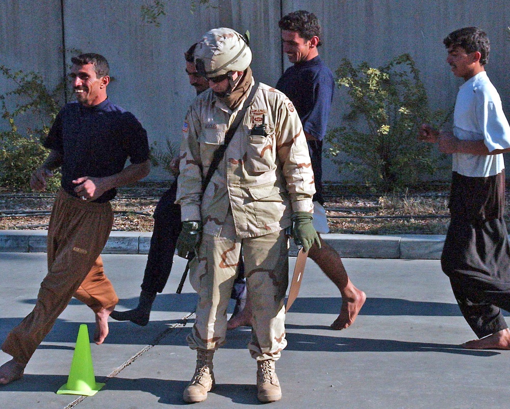 Sgt. Walter Miscles watches as a group of Iraqi Police applicant