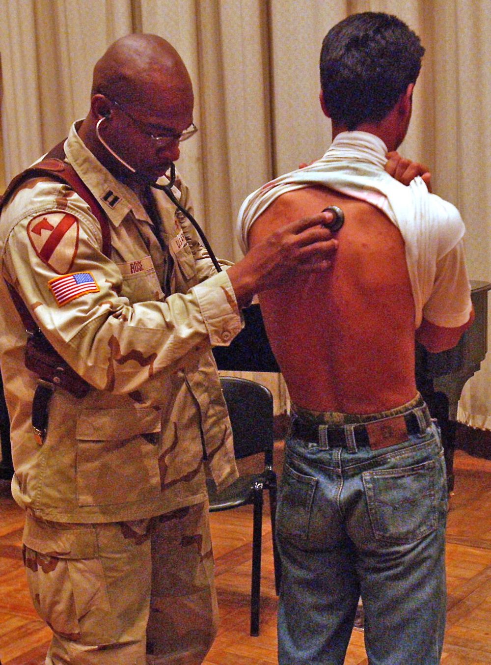 Capt. Michael Rose conducts a pulmonary exam