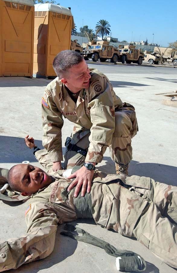 Sgt. William Benefield calls for a medic