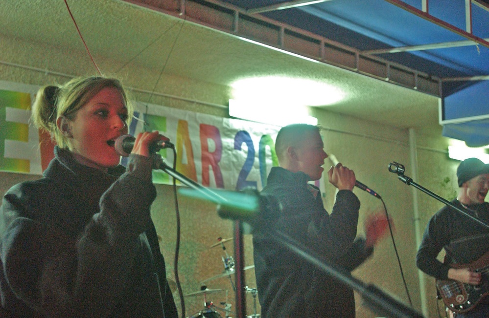 The band perform during a performance at the party