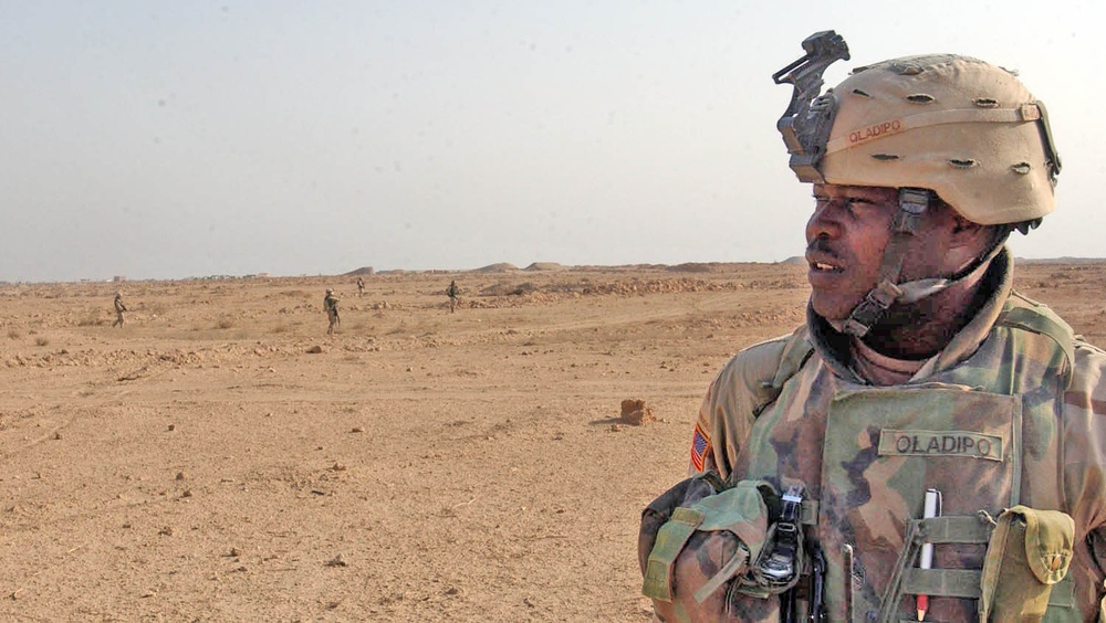 Staff Sgt. Akinola Oladipo looks on