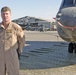 Staff Sgt. Glenn Stewart stands near one of 14 Chinooks