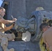 Mechanics replace an engine in one of 14 Chinook