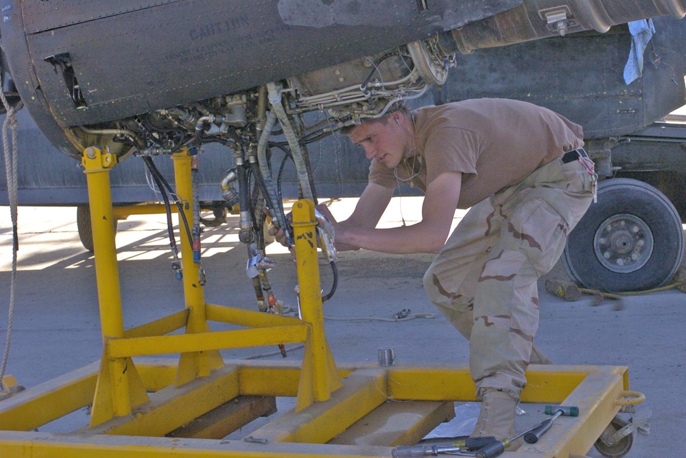 Spc. Chris Linke is repairing a leaky starter in an engine