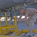 Spc. Chris Linke is repairing a leaky starter in an engine