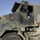 SSgt Shawn Hogan poses and enters his Heavy Equipment Transport