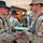 Lt. Col. Thomas MacDonald shakes hands with Spc. Matte