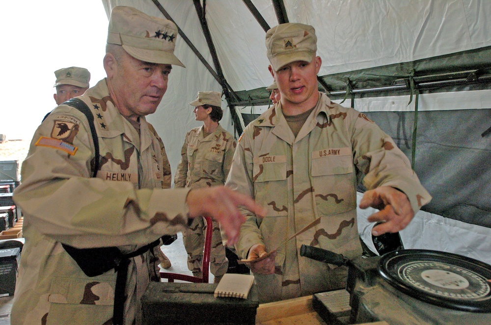 Sgt. Jonathan Diddle makes stencils to label ordnance