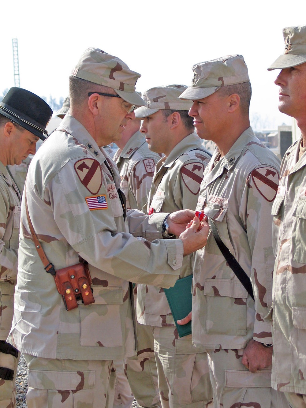 MGen. Chiarelli pins a Bronze Star Medal on MSgt. McCauslin