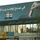 A billboard at a traffic intersection