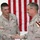 Sgt. Larry Ryan shakes hands with Brig Gen. Jeffry Hammond