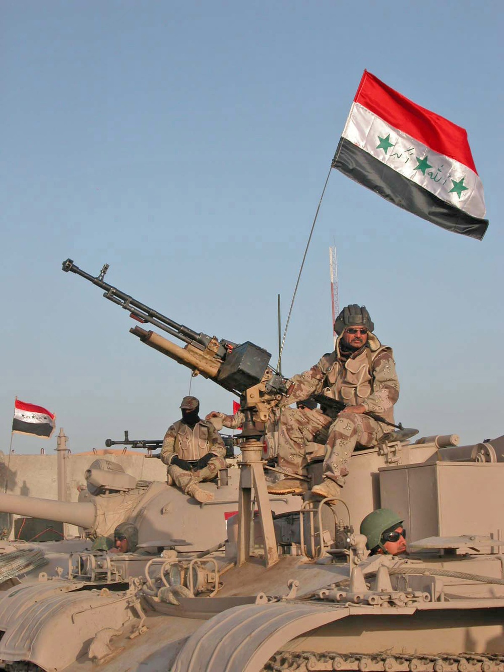 Election: Iraqi Soldiers sit atop of their tanks