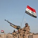 Election: Iraqi Soldiers sit atop of their tanks