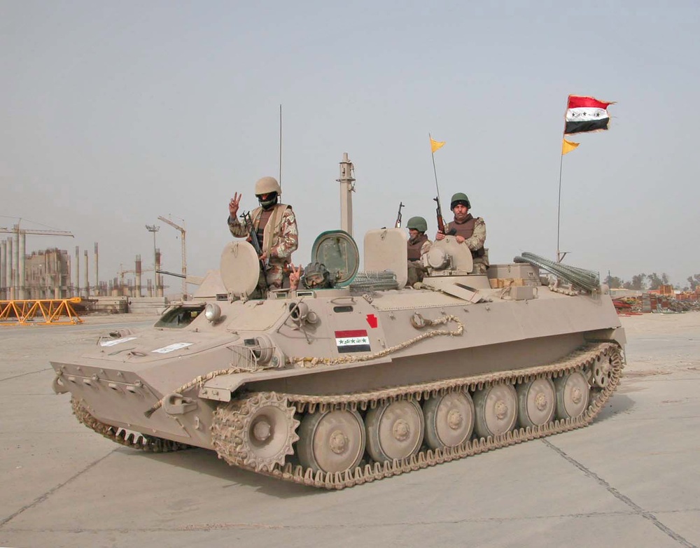 Elections: Iraqi Soldiers sit atop of their tanks