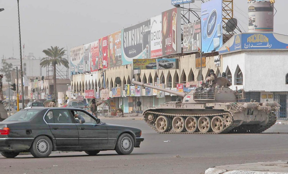 Election: A tank rumbles through the streets of central Baghdad