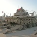 Elections: Soldiers of the Iraqi Army help unload the tanks