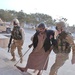 Paratroopers help Kadaam Hassoun into their aid station
